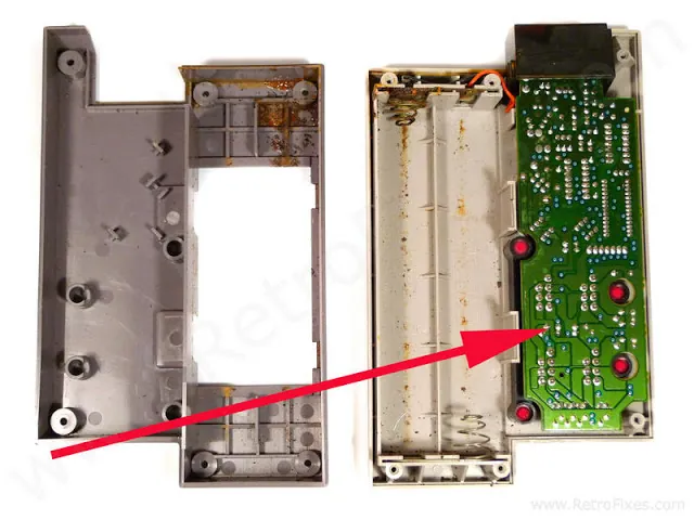 Removed outerpiece, additional screws hold motherboard to top